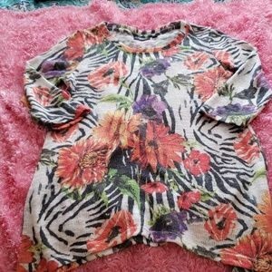 Asymmetrica sweater with animal and palm design